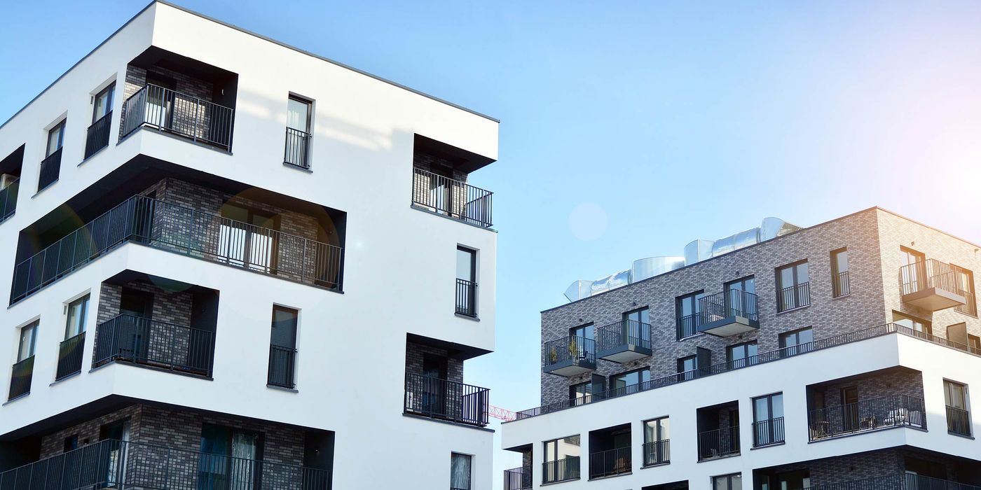 apartment complex exterior depicting smart device management and Dwelo alternatives